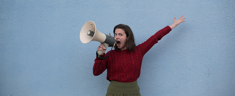 Woman using a megaphone