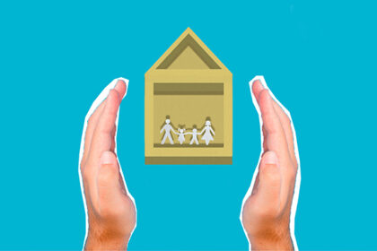 Hands insuring a home