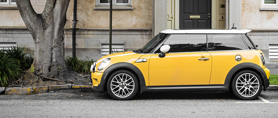 Yellow Mini Cooper Parked